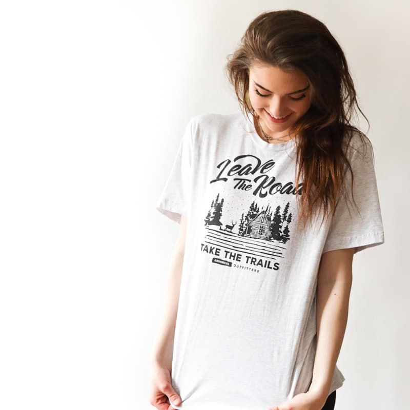 Model in a white printed cotton tee and black leggings